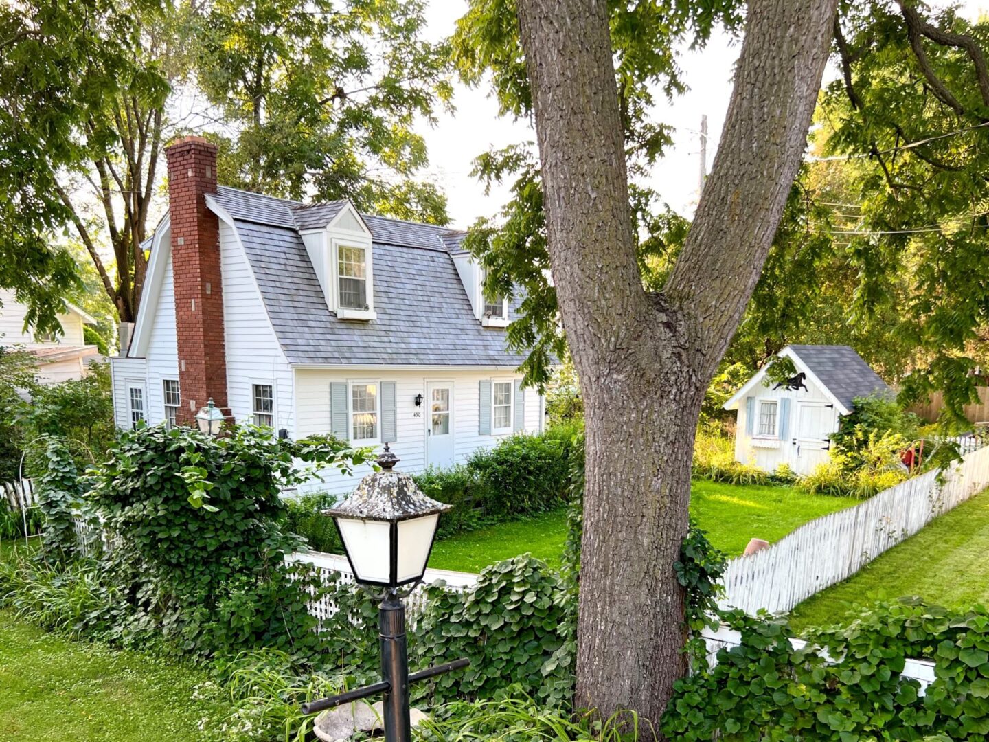 A lamp post in front of a house